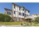 Rear exterior of a multi-story home featuring a Tudor style facade, brick foundation, and walkout deck at 16261 W Ellsworth Ave, Golden, CO 80401
