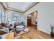 Inviting living room with hardwood floors, comfortable seating, and a view of the front entrance at 16261 W Ellsworth Ave, Golden, CO 80401