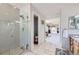 Main bathroom features a walk-in shower and opens to the main bedroom at 16261 W Ellsworth Ave, Golden, CO 80401