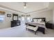Elegant main bedroom features neutral tones, large windows, and tray ceilings at 16261 W Ellsworth Ave, Golden, CO 80401