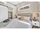 Bedroom featuring a sliding door closet, a large window, and comfortable bedding at 3219 W 19Th Ave # 4, Denver, CO 80204