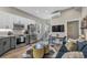 Stylish living room boasts stainless steel appliances, a sleek dining area, and comfortable modern seating at 3219 W 19Th Ave # 4, Denver, CO 80204