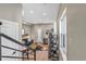 Open concept living room and kitchen with hardwood floors and black metal staircase at 3219 W 19Th Ave # 4, Denver, CO 80204