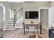 Open concept living space with modern staircase and dining area at 3219 W 19Th Ave # 4, Denver, CO 80204