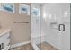 Modern walk-in shower featuring a built-in seat, a rainfall shower head, and a sleek glass door at 3219 W 19Th Ave # 4, Denver, CO 80204