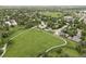 A beautiful aerial view showcases the neighborhood, emphasizing the home's location next to walking trails and open green space at 11762 W 34Th Ave, Wheat Ridge, CO 80033