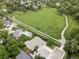 An aerial view captures the property with a backyard pool and a scenic walking trail bordering the well-kept lawn at 11762 W 34Th Ave, Wheat Ridge, CO 80033
