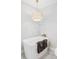 This modern bathroom features a freestanding tub, pendant lighting, and neutral tones at 11762 W 34Th Ave, Wheat Ridge, CO 80033