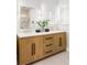 Bathroom vanity features a double sink, decorative lighting, and modern fixtures at 11762 W 34Th Ave, Wheat Ridge, CO 80033
