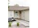 A cozy outdoor sitting area is adjacent to the front door and entry way at 11762 W 34Th Ave, Wheat Ridge, CO 80033