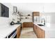 Bright kitchen with wood cabinets, stainless steel appliances, a large island, and barstool seating at 11762 W 34Th Ave, Wheat Ridge, CO 80033