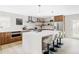 A bright and modern kitchen with stainless steel appliances and bar stool seating at 11762 W 34Th Ave, Wheat Ridge, CO 80033