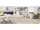 An open-concept living room and dining room with a kitchen bar at 11762 W 34Th Ave, Wheat Ridge, CO 80033