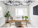 Bright office features floral wallpaper on the ceiling, a desk, and a modern chair at 11762 W 34Th Ave, Wheat Ridge, CO 80033