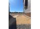 Level, unfinished backyard with views of neighborhood, ready for landscaping at 16562 E 109Th Ave, Commerce City, CO 80022