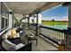 Relaxing outdoor seating area overlooking the scenic golf course and lake at 16562 E 109Th Ave, Commerce City, CO 80022