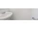 Bathroom featuring a pedestal sink with chrome faucet and accessible grab bar at 22123 E 38Th Pl, Aurora, CO 80019