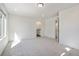 Bedroom featuring neutral carpet, light fixtures, with an attached bathroom at 22123 E 38Th Pl, Aurora, CO 80019