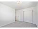 Bedroom featuring carpet, an open door, and a double door closet at 22123 E 38Th Pl, Aurora, CO 80019