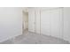 Bedroom features carpet, an open door, and a double door closet at 22123 E 38Th Pl, Aurora, CO 80019
