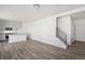 Spacious living room featuring an open floor plan, hardwood floors, and staircase to the upper level at 22123 E 38Th Pl, Aurora, CO 80019