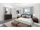 Bedroom with a bed, dresser, side tables, and a scenic view from the window at 22123 E 38Th Pl, Aurora, CO 80019