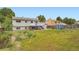 Lush backyard featuring a combination of green spaces and mature trees perfect for outdoor activities at 19196 E Kansas Dr, Aurora, CO 80017