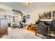 Spacious bedroom with carpeted floors, featuring Star Wars decor and a large gaming setup with multiple monitors at 19196 E Kansas Dr, Aurora, CO 80017