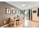 Dining room with modern table set, hardwood floors, and access to outdoor balcony at 19196 E Kansas Dr, Aurora, CO 80017