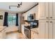 Updated kitchen with granite countertops, stainless steel appliances, and white cabinets at 19196 E Kansas Dr, Aurora, CO 80017
