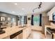 Bright kitchen with an island, stainless steel appliances, and a view to the outside at 19196 E Kansas Dr, Aurora, CO 80017
