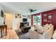 Spacious living area featuring hardwood floors, stylish decor, and a cozy sectional sofa at 19196 E Kansas Dr, Aurora, CO 80017