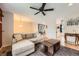Open-concept living area with hardwood floors, neutral decor, and seamless flow to dining area at 19196 E Kansas Dr, Aurora, CO 80017