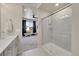 Well-lit bathroom featuring a walk-in shower with a glass door at 5738 N Vivian St, Arvada, CO 80002