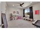 Spacious bedroom with a ceiling fan, large windows with black out curtains, and neutral-colored walls at 5738 N Vivian St, Arvada, CO 80002