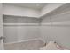Walk-in closet with shelving, carpeted floor, and ample storage space at 5738 N Vivian St, Arvada, CO 80002