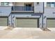 Attached garages offer convenient parking and storage, with modern lighting fixtures enhancing curb appeal at 5738 N Vivian St, Arvada, CO 80002