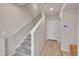 Hallway featuring hardwood floors and stairs to the second level at 5738 N Vivian St, Arvada, CO 80002