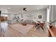 Spacious living room with a dining area, a comfortable sectional sofa, and a large pink rug at 5738 N Vivian St, Arvada, CO 80002