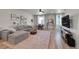 Bright living room with hardwood floors, a comfortable sofa, and a large rug at 5738 N Vivian St, Arvada, CO 80002