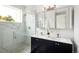 Modern bathroom boasting a walk-in shower, double vanity, and stylish fixtures at 5462 S Cedar St, Littleton, CO 80120