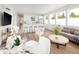 Inviting open-concept living space with modern decor, kitchen island, and bright, airy atmosphere at 5462 S Cedar St, Littleton, CO 80120
