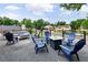 Spacious patio featuring outdoor seating, a fire pit, and views of the neighborhood at 5462 S Cedar St, Littleton, CO 80120