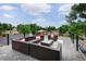 Inviting rooftop deck with stylish wicker furniture and neighborhood views, perfect for relaxing or entertaining guests at 5462 S Cedar St, Littleton, CO 80120
