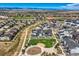 Wide aerial view of homes, a sports complex, and a park in the neighborhood at 16546 Umatilla Place, Broomfield, CO 80023