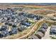 A Primary-planned community aerial view showcasing green spaces and modern homes at 16546 Umatilla Place, Broomfield, CO 80023