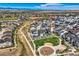 Expansive aerial view featuring neighborhood homes, a park and a sports field at 16546 Umatilla Place, Broomfield, CO 80023