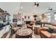 Finished basement with recreational space, leather seating, game table, bar, and wall decor at 16546 Umatilla Place, Broomfield, CO 80023