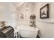 Elegant bathroom with a standalone tub and decorative lighting, creating a relaxing space at 16546 Umatilla Place, Broomfield, CO 80023