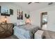 Cozy bedroom features a large bed, stylish decor, and an ottoman at the foot of the bed at 16546 Umatilla Place, Broomfield, CO 80023